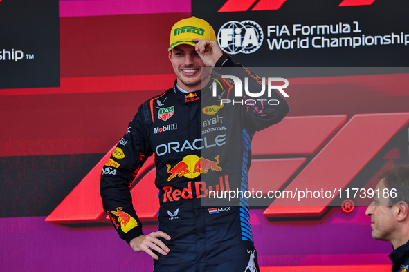 Max Verstappen of the Netherlands drives the Oracle Red Bull Racing RB20 Honda RBPT and wins the race on the podium during the Formula 1 Len...