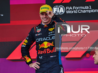 Max Verstappen of the Netherlands drives the Oracle Red Bull Racing RB20 Honda RBPT and wins the race on the podium during the Formula 1 Len...