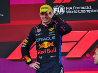 Max Verstappen of the Netherlands drives the Oracle Red Bull Racing RB20 Honda RBPT and wins the race on the podium during the Formula 1 Len...