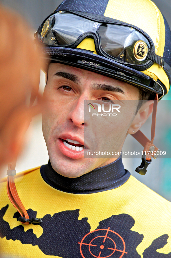 Jockey Leo Salles speaks with connections following the second race at Woodbine Racetrack in Toronto, Canada, on November 3, 2024. 