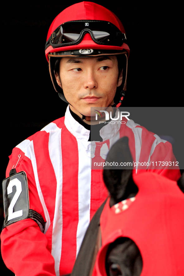 Jockey Daisuke Fukumoto rides out of the paddock ahead of a race at Woodbine Racetrack in Toronto, Canada, on November 3, 2024. 