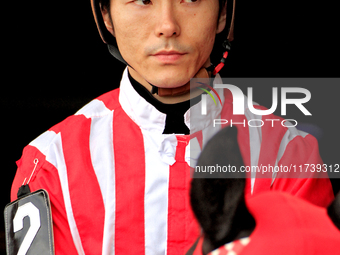 Jockey Daisuke Fukumoto rides out of the paddock ahead of a race at Woodbine Racetrack in Toronto, Canada, on November 3, 2024. (