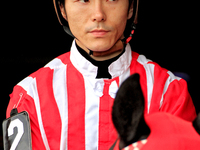 Jockey Daisuke Fukumoto rides out of the paddock ahead of a race at Woodbine Racetrack in Toronto, Canada, on November 3, 2024. (