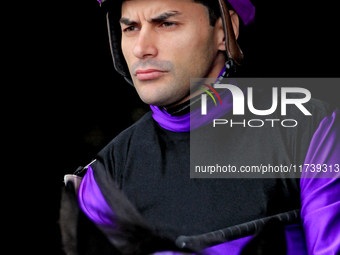 Jockey Sahin Civaci rides out of the paddock ahead of a race at Woodbine Racetrack in Toronto, Canada, on November 3, 2024. (