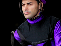 Jockey Sahin Civaci rides out of the paddock ahead of a race at Woodbine Racetrack in Toronto, Canada, on November 3, 2024. (