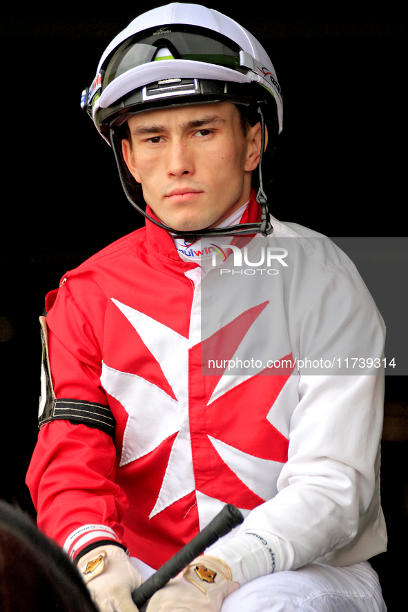 Jockey Fraser Aebly rides out of the paddock ahead of a race at Woodbine Racetrack in Toronto, Canada, on November 3, 2024. 