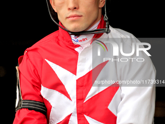 Jockey Fraser Aebly rides out of the paddock ahead of a race at Woodbine Racetrack in Toronto, Canada, on November 3, 2024. (