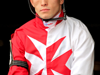 Jockey Fraser Aebly rides out of the paddock ahead of a race at Woodbine Racetrack in Toronto, Canada, on November 3, 2024. (