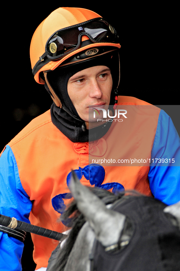 Jockey Ryan Munger rides out of the paddock ahead of a race at Woodbine Racetrack in Toronto, Canada, on November 3, 2024. 