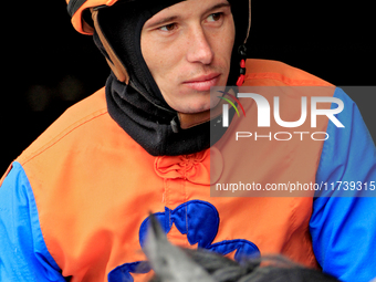 Jockey Ryan Munger rides out of the paddock ahead of a race at Woodbine Racetrack in Toronto, Canada, on November 3, 2024. (