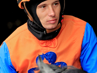 Jockey Ryan Munger rides out of the paddock ahead of a race at Woodbine Racetrack in Toronto, Canada, on November 3, 2024. (