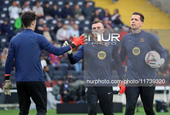 Inaki Pena, Ander Astralaga, and Wojciech Szczesny play during the match between FC Barcelona and RCD Espanyol, corresponding to week 12 of...