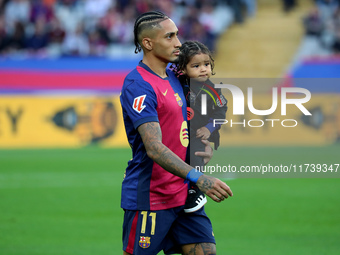 Raphinha Dias is with his son Gael during the match between FC Barcelona and RCD Espanyol, corresponding to week 12 of LaLiga EA Sports, at...