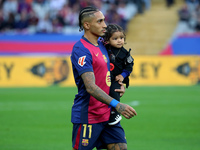 Raphinha Dias is with his son Gael during the match between FC Barcelona and RCD Espanyol, corresponding to week 12 of LaLiga EA Sports, at...