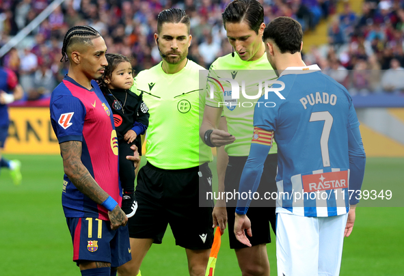 Raphinha Dias is with his son Gael during the match between FC Barcelona and RCD Espanyol, corresponding to week 12 of LaLiga EA Sports, at...