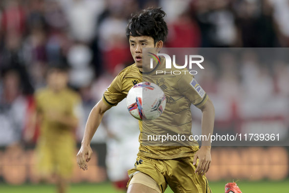 Takefusa Kubo of Real Sociedad controls the ball during the La Liga EA Sports match between Sevilla FC and Real Sociedad at Sanchez Pizjuan...