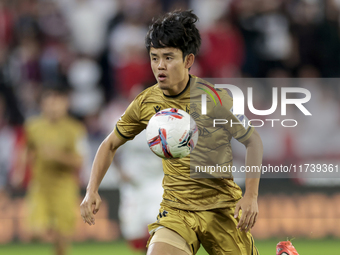 Takefusa Kubo of Real Sociedad controls the ball during the La Liga EA Sports match between Sevilla FC and Real Sociedad at Sanchez Pizjuan...