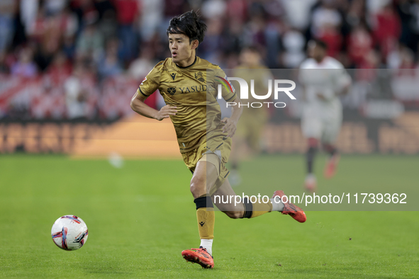 Takefusa Kubo of Real Sociedad runs with the ball during the La Liga EA Sports match between Sevilla FC and Real Sociedad at Sanchez Pizjuan...