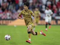 Takefusa Kubo of Real Sociedad runs with the ball during the La Liga EA Sports match between Sevilla FC and Real Sociedad at Sanchez Pizjuan...