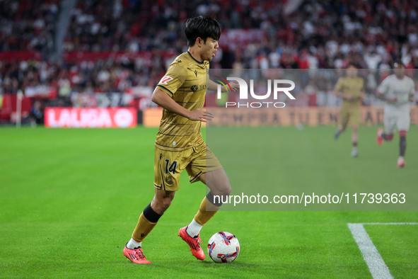 Takefusa Kubo of Real Sociedad runs with the ball during the La Liga EA Sports match between Sevilla FC and Real Sociedad at Sanchez Pizjuan...