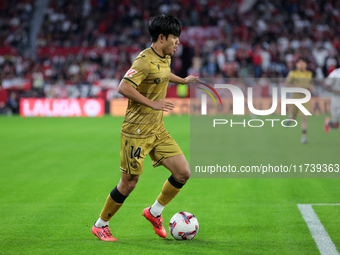 Takefusa Kubo of Real Sociedad runs with the ball during the La Liga EA Sports match between Sevilla FC and Real Sociedad at Sanchez Pizjuan...