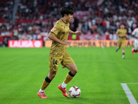 Takefusa Kubo of Real Sociedad runs with the ball during the La Liga EA Sports match between Sevilla FC and Real Sociedad at Sanchez Pizjuan...