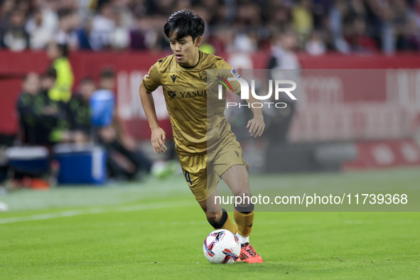 Takefusa Kubo of Real Sociedad runs with the ball during the La Liga EA Sports match between Sevilla FC and Real Sociedad at Sanchez Pizjuan...