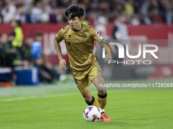 Takefusa Kubo of Real Sociedad runs with the ball during the La Liga EA Sports match between Sevilla FC and Real Sociedad at Sanchez Pizjuan...