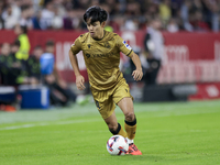 Takefusa Kubo of Real Sociedad runs with the ball during the La Liga EA Sports match between Sevilla FC and Real Sociedad at Sanchez Pizjuan...