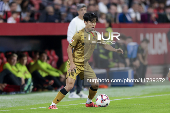 Takefusa Kubo of Real Sociedad controls the ball during the La Liga EA Sports match between Sevilla FC and Real Sociedad at Sanchez Pizjuan...