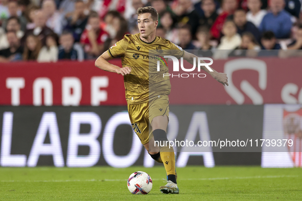 Luka Sucic of Real Sociedad runs with the ball during the La Liga EA Sports match between Sevilla FC and Real Sociedad at Sanchez Pizjuan in...