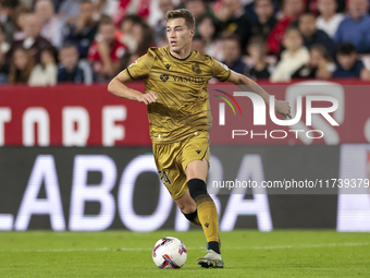 Luka Sucic of Real Sociedad runs with the ball during the La Liga EA Sports match between Sevilla FC and Real Sociedad at Sanchez Pizjuan in...