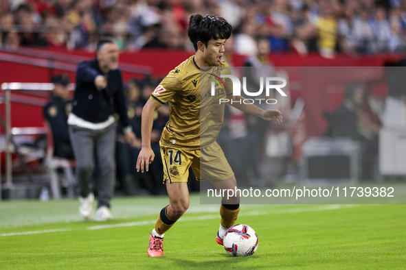 Takefusa Kubo of Real Sociedad runs with the ball during the La Liga EA Sports match between Sevilla FC and Real Sociedad at Sanchez Pizjuan...