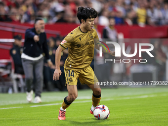 Takefusa Kubo of Real Sociedad runs with the ball during the La Liga EA Sports match between Sevilla FC and Real Sociedad at Sanchez Pizjuan...