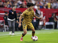 Takefusa Kubo of Real Sociedad runs with the ball during the La Liga EA Sports match between Sevilla FC and Real Sociedad at Sanchez Pizjuan...