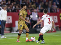 Takefusa Kubo of Real Sociedad battles for the ball during the La Liga EA Sports match between Sevilla FC and Real Sociedad at Sanchez Pizju...