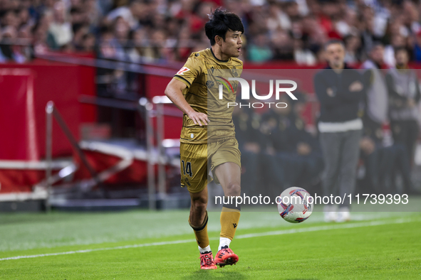 Takefusa Kubo of Real Sociedad runs with the ball during the La Liga EA Sports match between Sevilla FC and Real Sociedad at Sanchez Pizjuan...