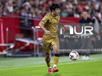 Takefusa Kubo of Real Sociedad runs with the ball during the La Liga EA Sports match between Sevilla FC and Real Sociedad at Sanchez Pizjuan...