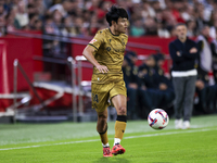 Takefusa Kubo of Real Sociedad runs with the ball during the La Liga EA Sports match between Sevilla FC and Real Sociedad at Sanchez Pizjuan...