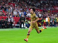 Takefusa Kubo of Real Sociedad celebrates a goal during the La Liga EA Sports match between Sevilla FC and Real Sociedad at Sanchez Pizjuan...