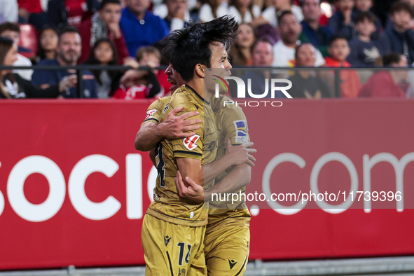 Takefusa Kubo of Real Sociedad celebrates a goal during the La Liga EA Sports match between Sevilla FC and Real Sociedad at Sanchez Pizjuan...