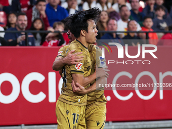 Takefusa Kubo of Real Sociedad celebrates a goal during the La Liga EA Sports match between Sevilla FC and Real Sociedad at Sanchez Pizjuan...