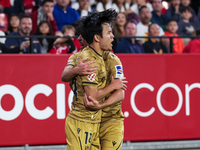 Takefusa Kubo of Real Sociedad celebrates a goal during the La Liga EA Sports match between Sevilla FC and Real Sociedad at Sanchez Pizjuan...