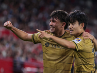 Takefusa Kubo of Real Sociedad celebrates a goal during the La Liga EA Sports match between Sevilla FC and Real Sociedad at Sanchez Pizjuan...