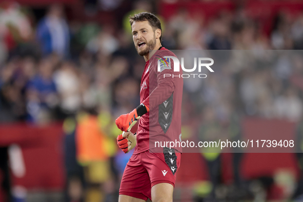 Alex Remiro of Real Sociedad celebrates a goal during the La Liga EA Sports match between Sevilla FC and Real Sociedad at Sanchez Pizjuan in...