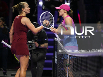 RIYADH, SAUDI ARABIA - NOVEMBER 03: Barbora Krejcikovas of Czech Republic congratulates Iga Swiatek of Poland on day 2 of the 2024 WTA Final...