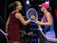 RIYADH, SAUDI ARABIA - NOVEMBER 03: Barbora Krejcikovas of Czech Republic congratulates Iga Swiatek of Poland on day 2 of the 2024 WTA Final...