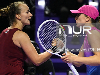 RIYADH, SAUDI ARABIA - NOVEMBER 03: Barbora Krejcikovas of Czech Republic congratulates Iga Swiatek of Poland on day 2 of the 2024 WTA Final...