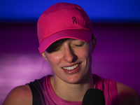 RIYADH, SAUDI ARABIA - NOVEMBER 03: Iga Swiatek of Poland speaks to the media after winning her opening match against Barbora Krejcikova of...