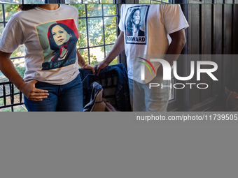 Supporters of Vice President Kamala Harris wear shirts with her image on them at a Get Out the Vote event in Harrisburg, Pennsylvania, Unite...